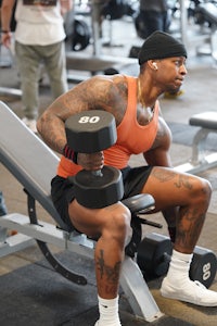 a man lifting weights in a gym